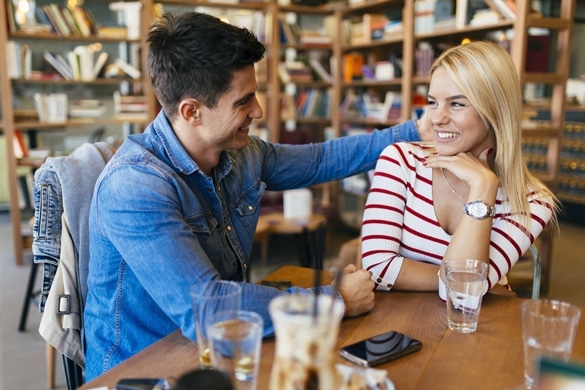 Beautiful couple in love flirting in restaurant and bonding - How To Get A Taurus Man To Make The First Move