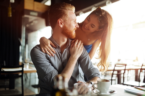 Beautiful man and woman flirting in a cafe - Does the Taurus man like to be chased