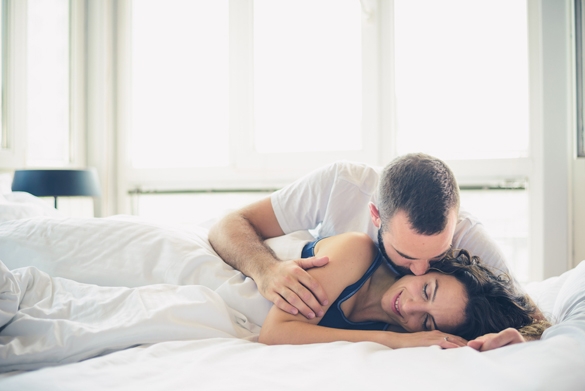 Young Taurus man and woman in bed - what taurus men like and dislike in a woman