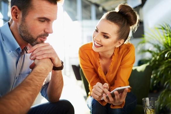 Happy couple at cafe sitting together and talking - How To Seduce A Taurus Man With Words