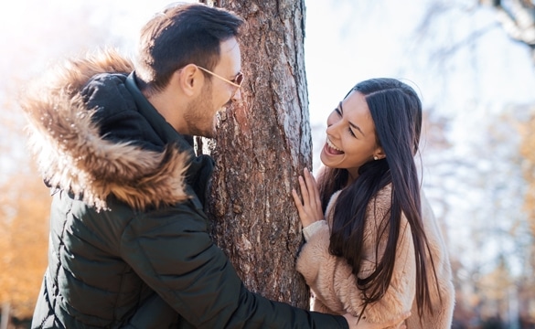 Romantic couple having beautiful moments of happiness and joy in the autumn park - What Does a Taurus Man Like in a Capricorn Woman