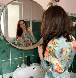 Anna Kovach astrologer in the bathroom
