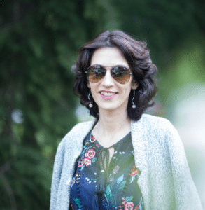 Anna Kovach Astrologer Compatibility Anna Kovach wearing glasses outdoor